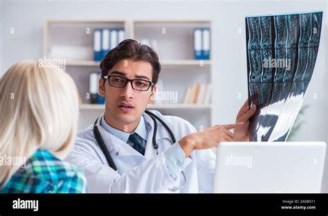 Male doctor examining x.